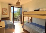 10 children bedroom with exit onto terrace with glimpse of the lake como