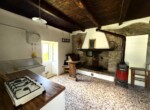 2. Stone house near argegno green area